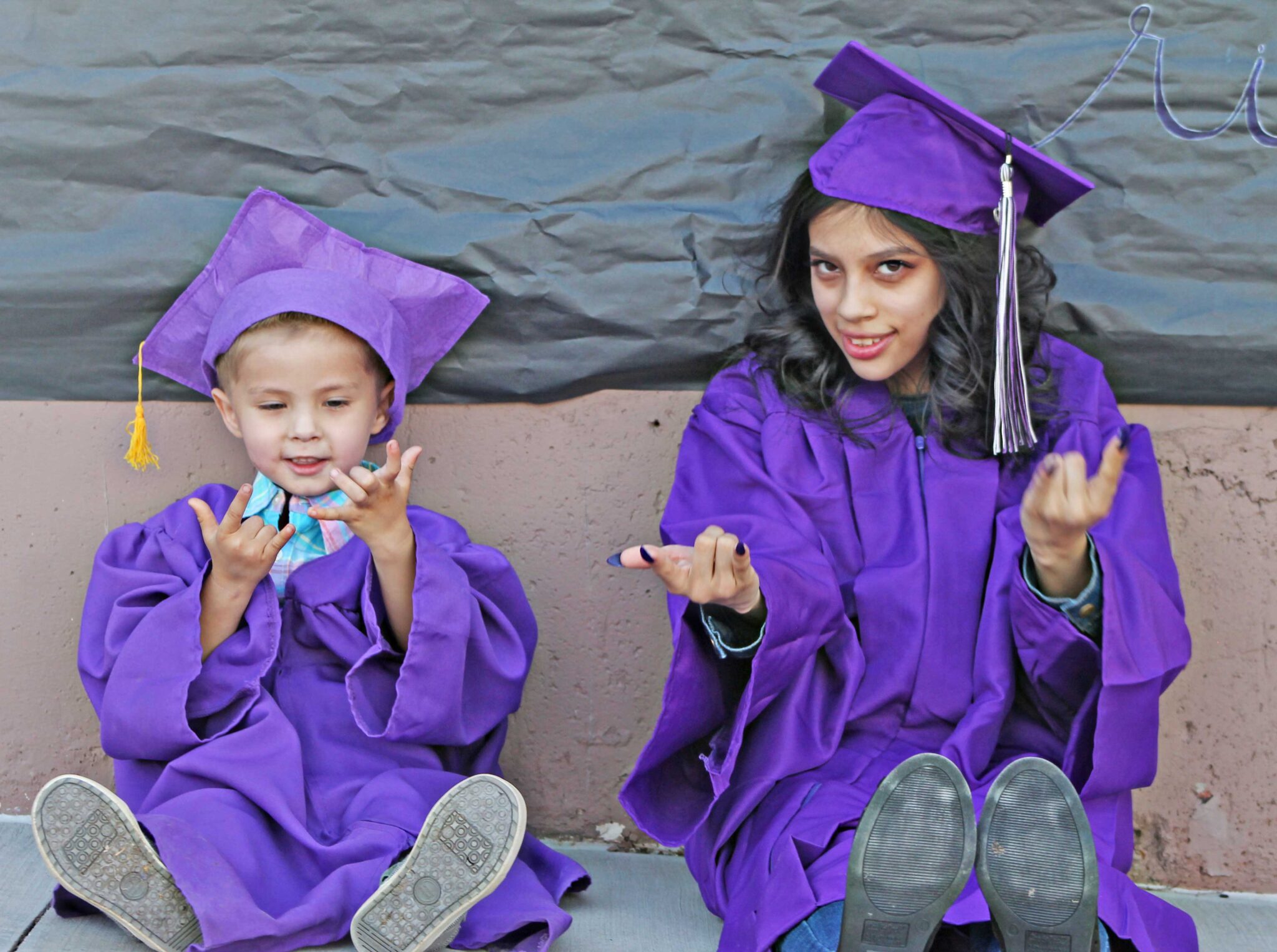 Candi and Angelo posing at graduation