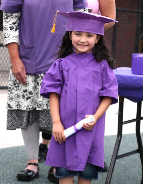 Eliana posing at graduation