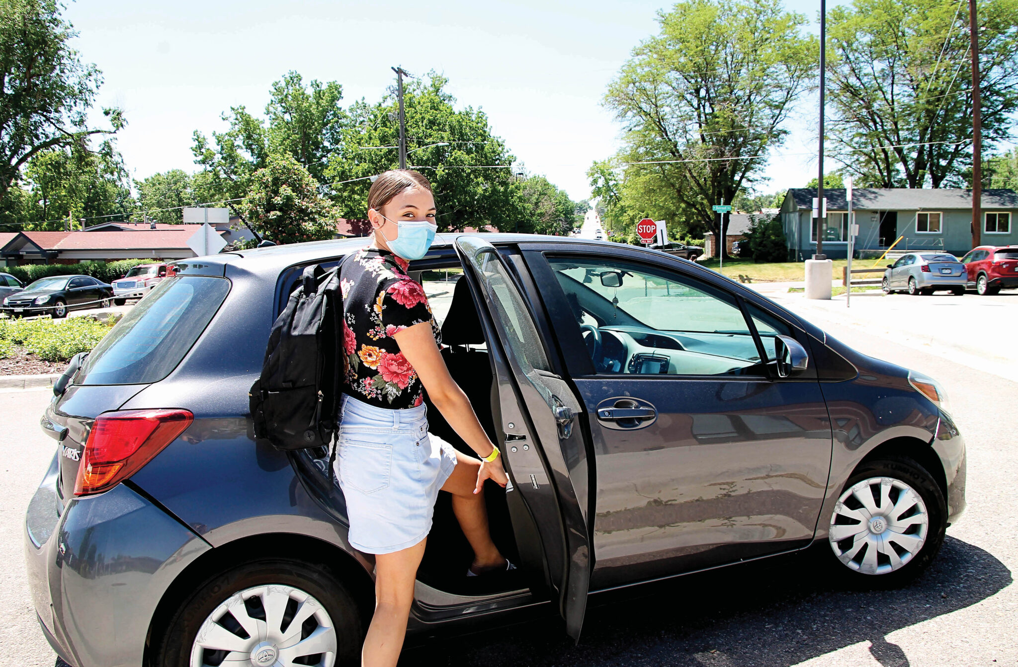 Student getting into a car